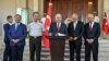 Turkey's Prime Minister Binali Yildirim, center, Chief of Staff Gen. Hulusi Akar, center left, Justice Minister Bekir Bozdag, left, Interior Minister Efkan Ala, second right, and Defense Minister Fikri Isik attend a press conference in Ankara, Turkey, Sat